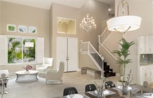 Entry and stairway with high ceilings, chair, and art