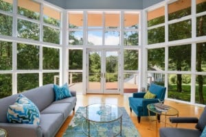 Living room surrounded by glass. Outdoor allergens not far from coming inside your home to create indoor allergies
