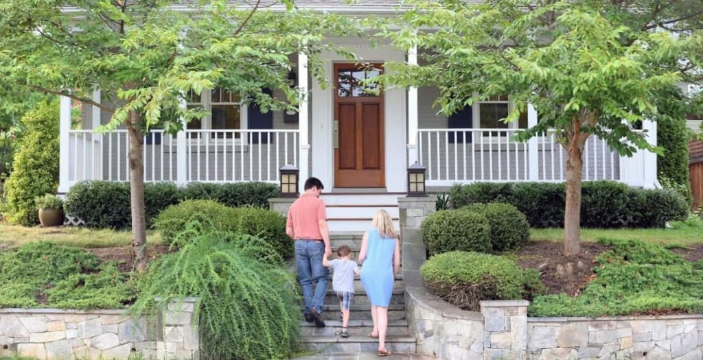 Family walking into their home