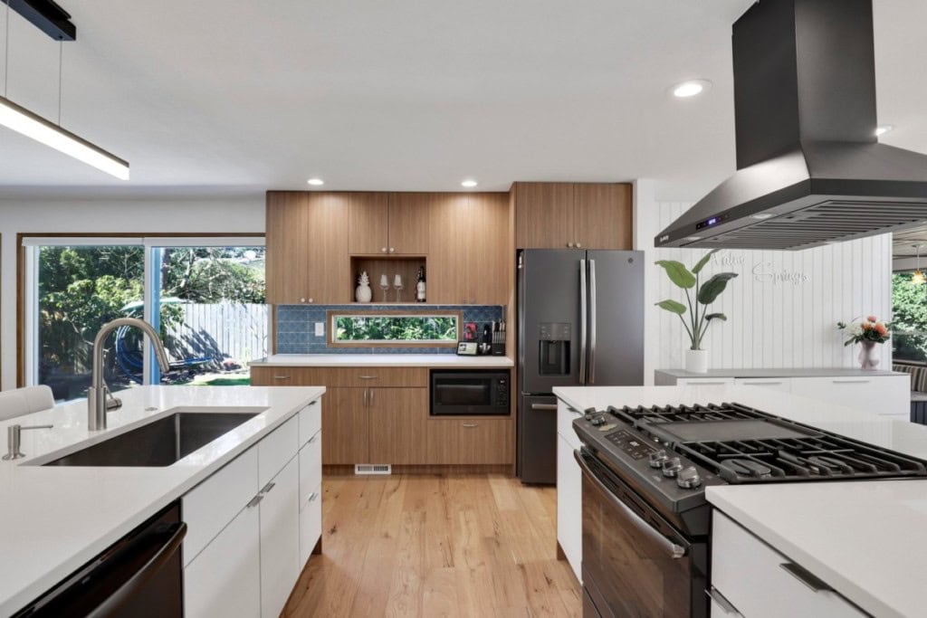 A kitchen with updated black appliances