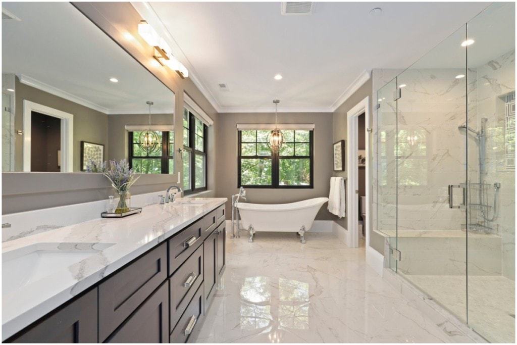 A large bathroom with a tub, vanity, and shower