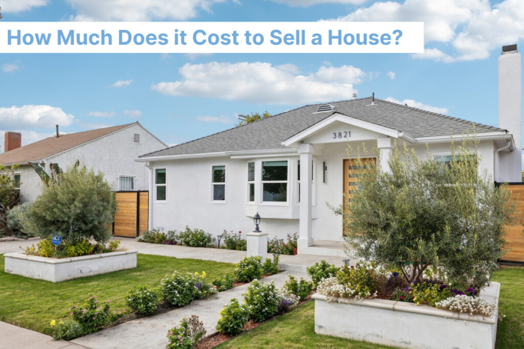 How much does it cost to sell a house - white quaint home with manicured lawn
