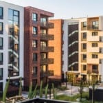 A community complex several stories high with proper apartment security