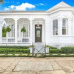 historic home in new orleans with pristine white exterior
