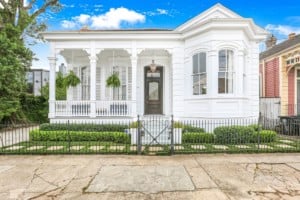 historic home in new orleans with pristine white exterior