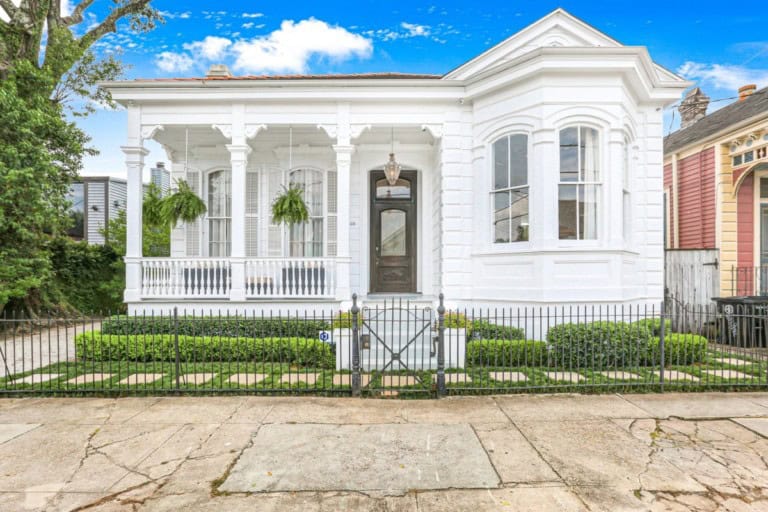 historic home in new orleans with pristine white exterior