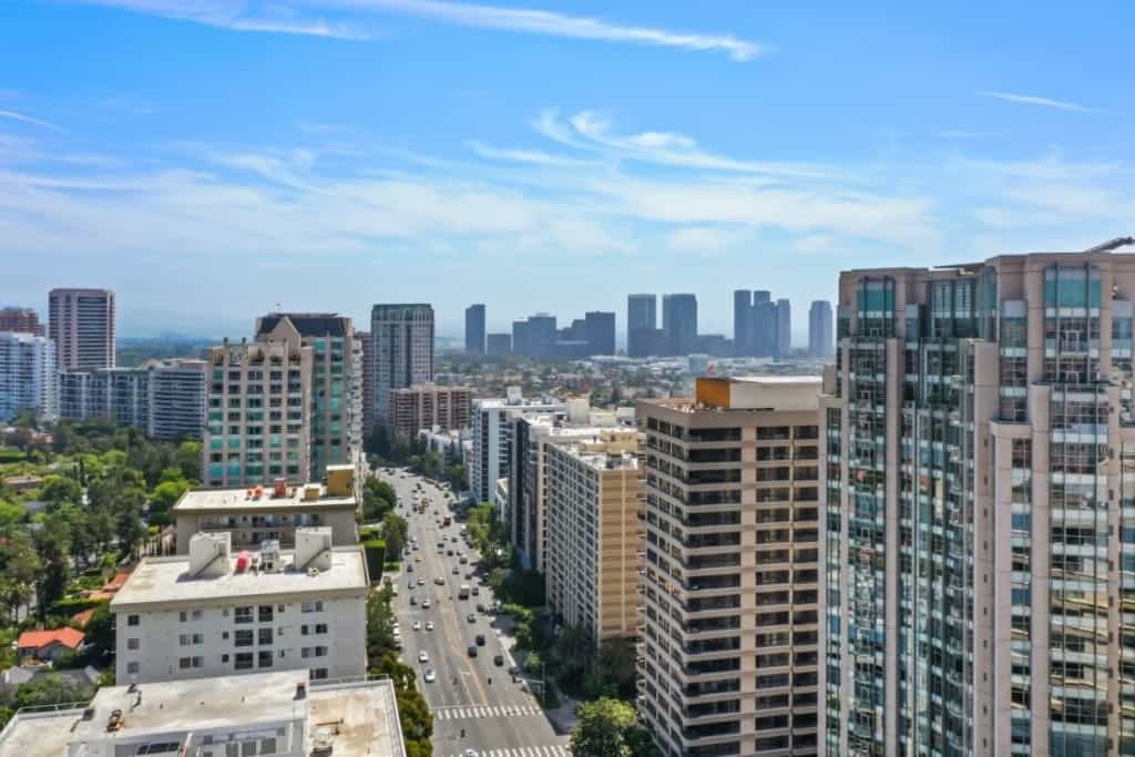 new apartment buildings in a city with the skyline in the back