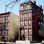 Brown concrete building providing affordable housing for tenants