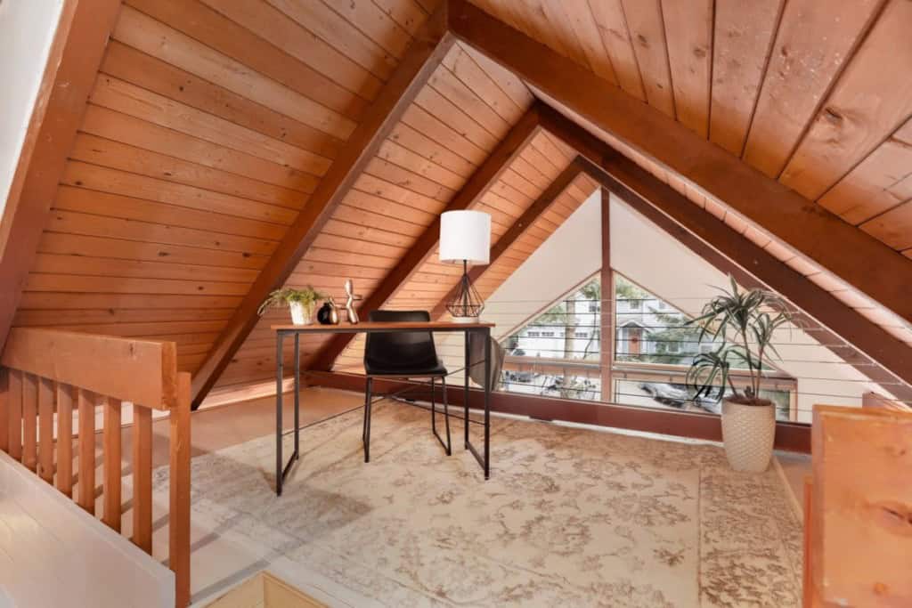 office space with very sloped ceilings