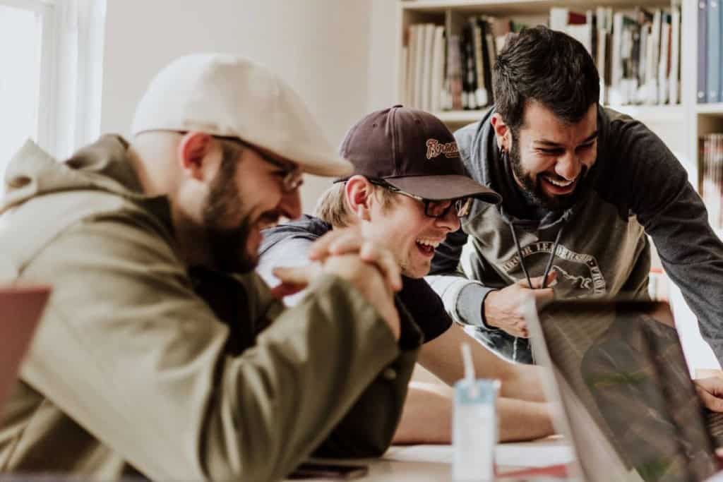 roommates laughing around a table