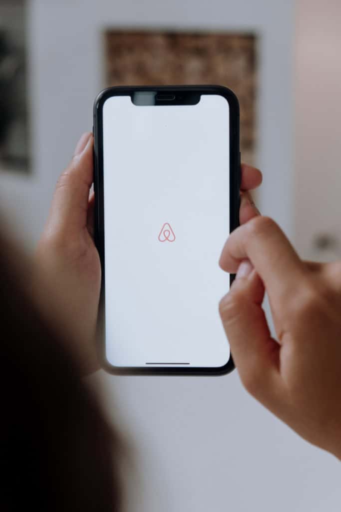 Person opening the Airbnb app and creating a free account