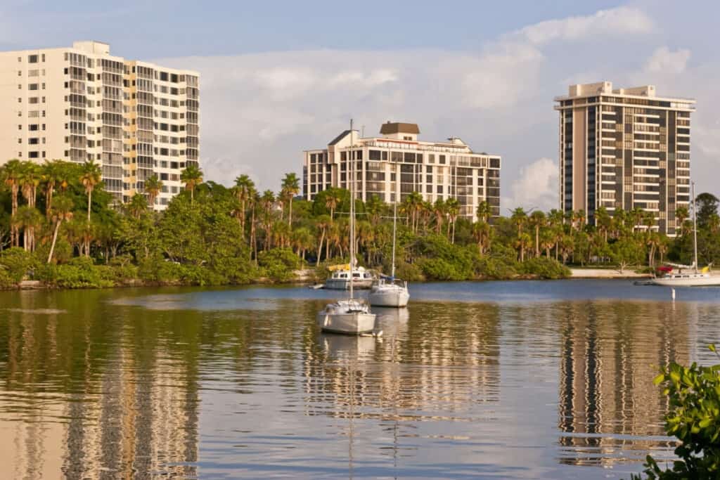 Waterfront apartment buildings at the Gulf of Mexico at sunset, Sarasota, Florida. Beautiful condominiums with waterfront views.