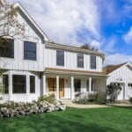 white farmhouse in naperville with manicured yard