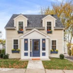 home with blue doors and tan exterior