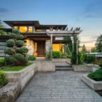 modern home with brick walkway