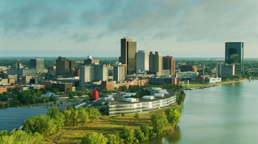 Aerial shot of Toledo, Ohio on a summer morning, taking in the downtown on the banks of the Maumee River, and the Anthony Wayne Bridge.