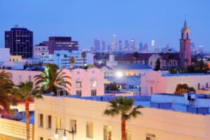 Hollywood is a district in Los Angeles, California, United States situated west-northwest of downtown Los Angeles. Due to its fame and cultural identity as the historical center of movie studios and movie stars, the word Hollywood is often used as a metonym of American cinema.