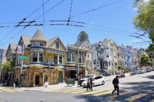 people crossing the street in Haight-Ashbury neighborhood of San Francisco