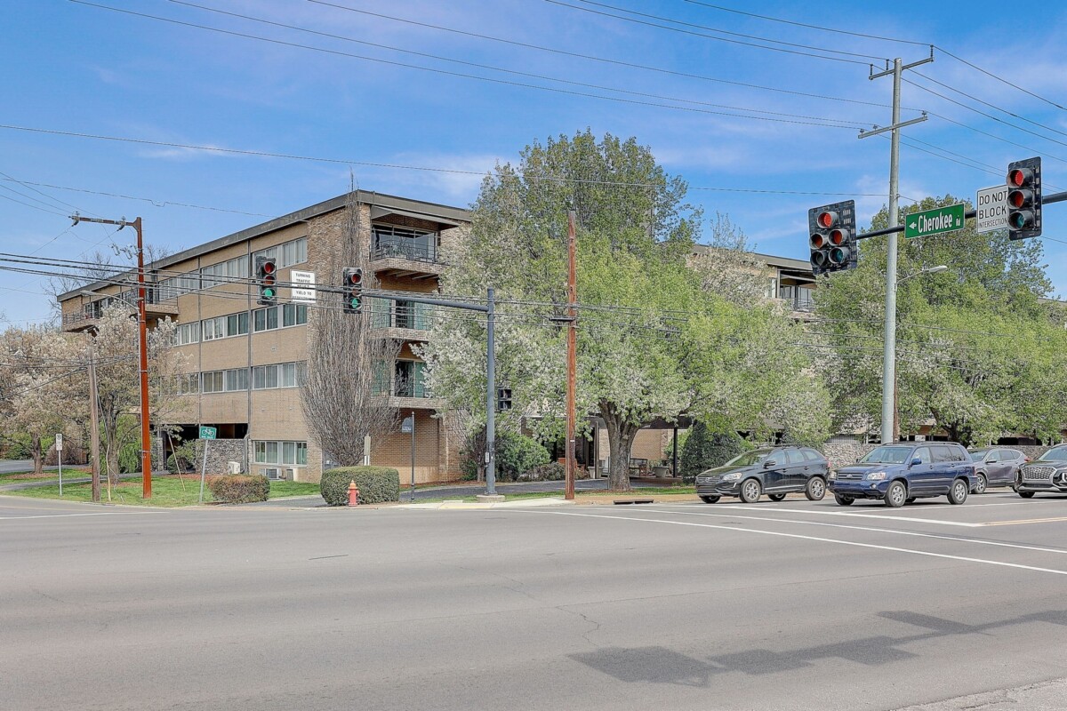 view of street with mid rise condo building in green hills nashville, tn