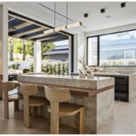 Professionally photographed kitchen view with a big window