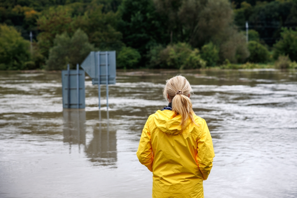 A woman overlooking a flooded area
