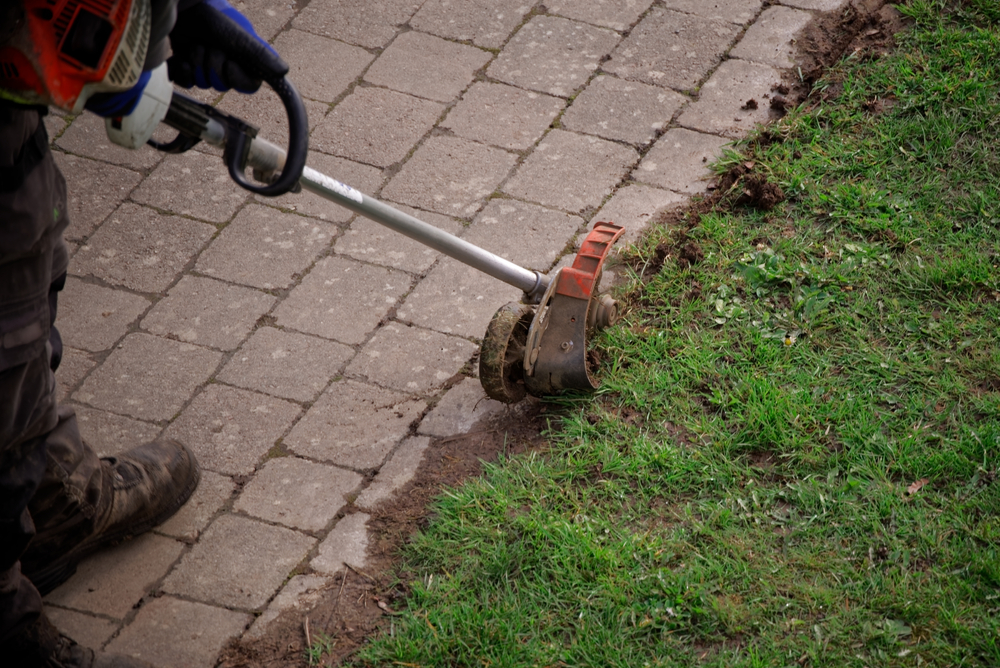gardener trimming pathway