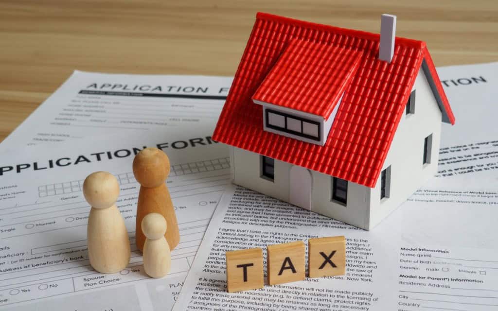 House or building or land value property tax, local development tax concept Word tax, home model