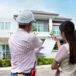 home inspector and potential buyer examining the home
