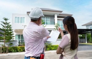 home inspector and potential buyer examining the home