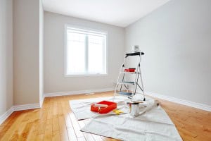 freshly painted room with supplies in the middle of the room