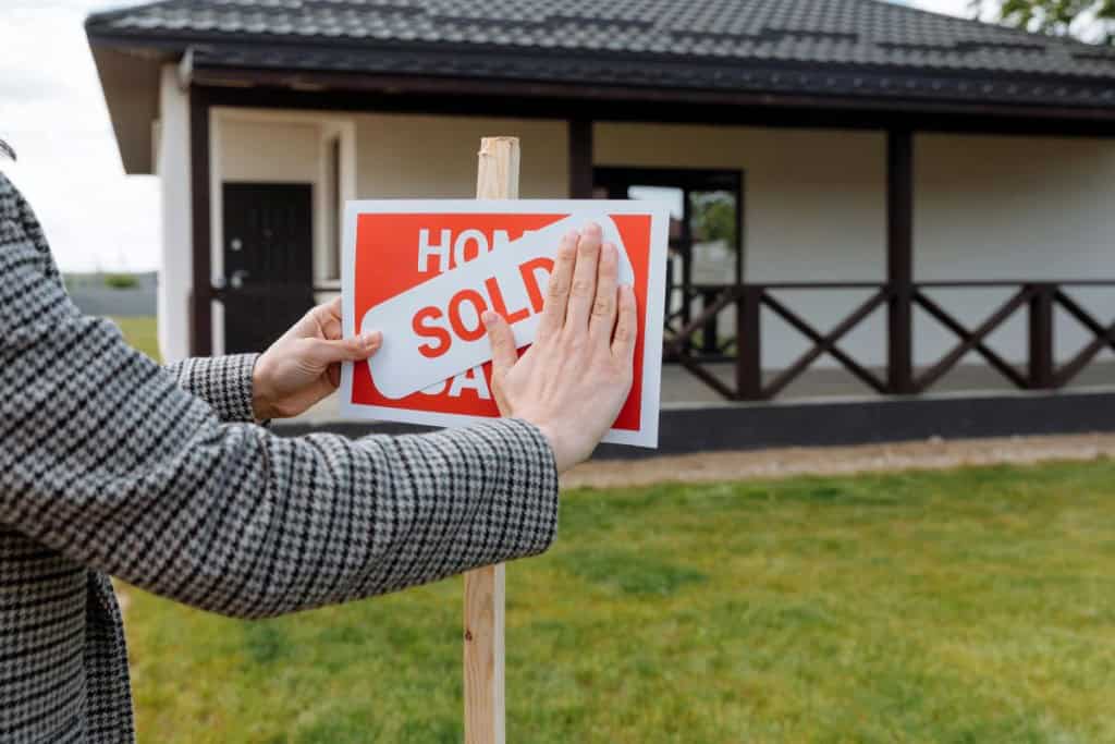 Home sold sign after finding out how much house you can afford with $50k salary.