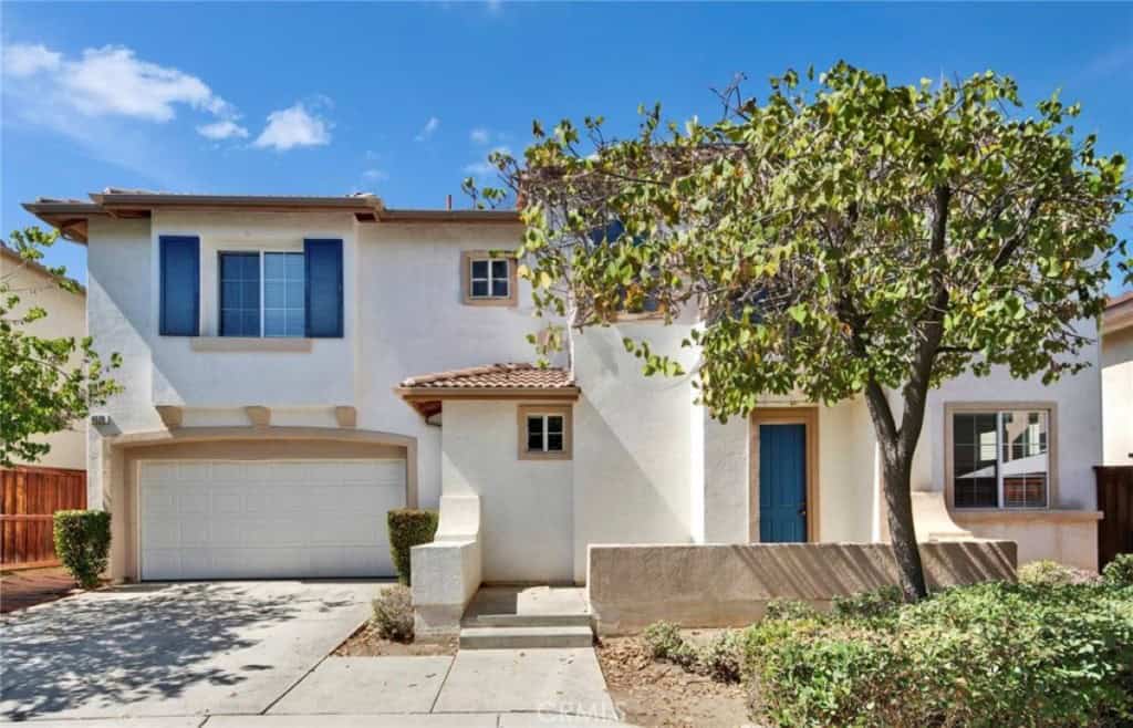 riverside, ca home with tree in front