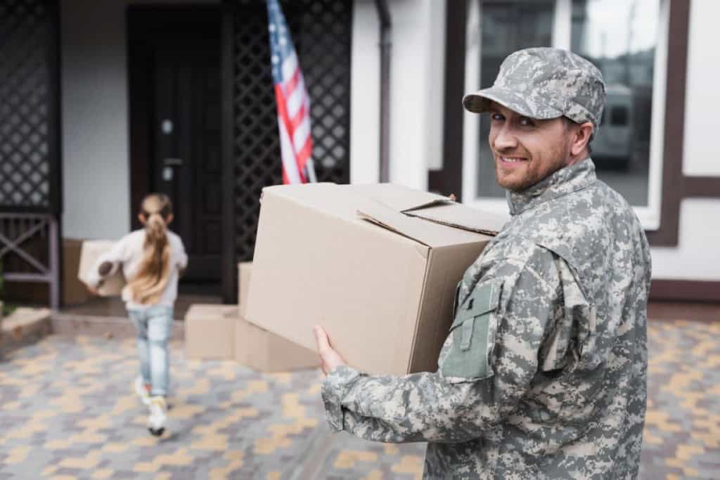 A veteran and their family moving into their new home.