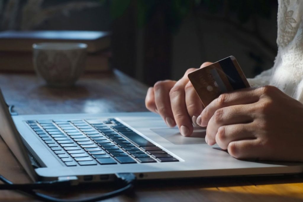 A person making a payment online with their credit card