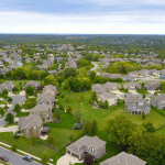 Aerial view of a planned suburban neighborhood with single-family homes, illustrating what is a PID in real estate.