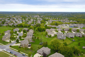 Aerial view of a planned suburban neighborhood with single-family homes, illustrating what is a PID in real estate.