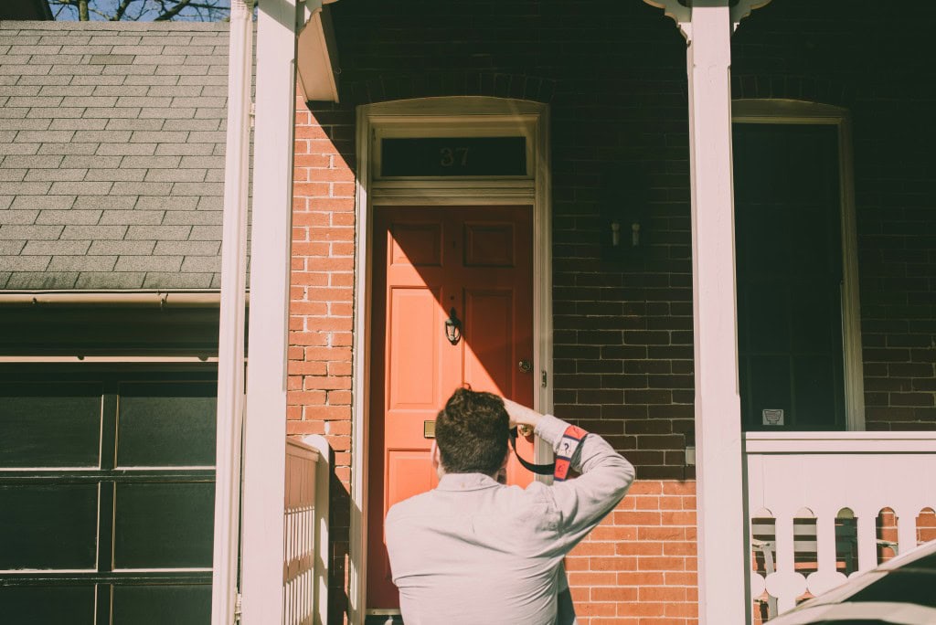 photographer taking an image of the front of a house