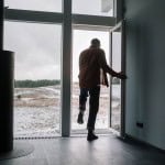 man leaving out of door