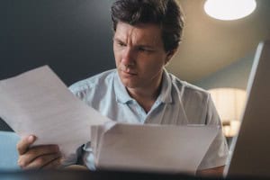 man looking at papers